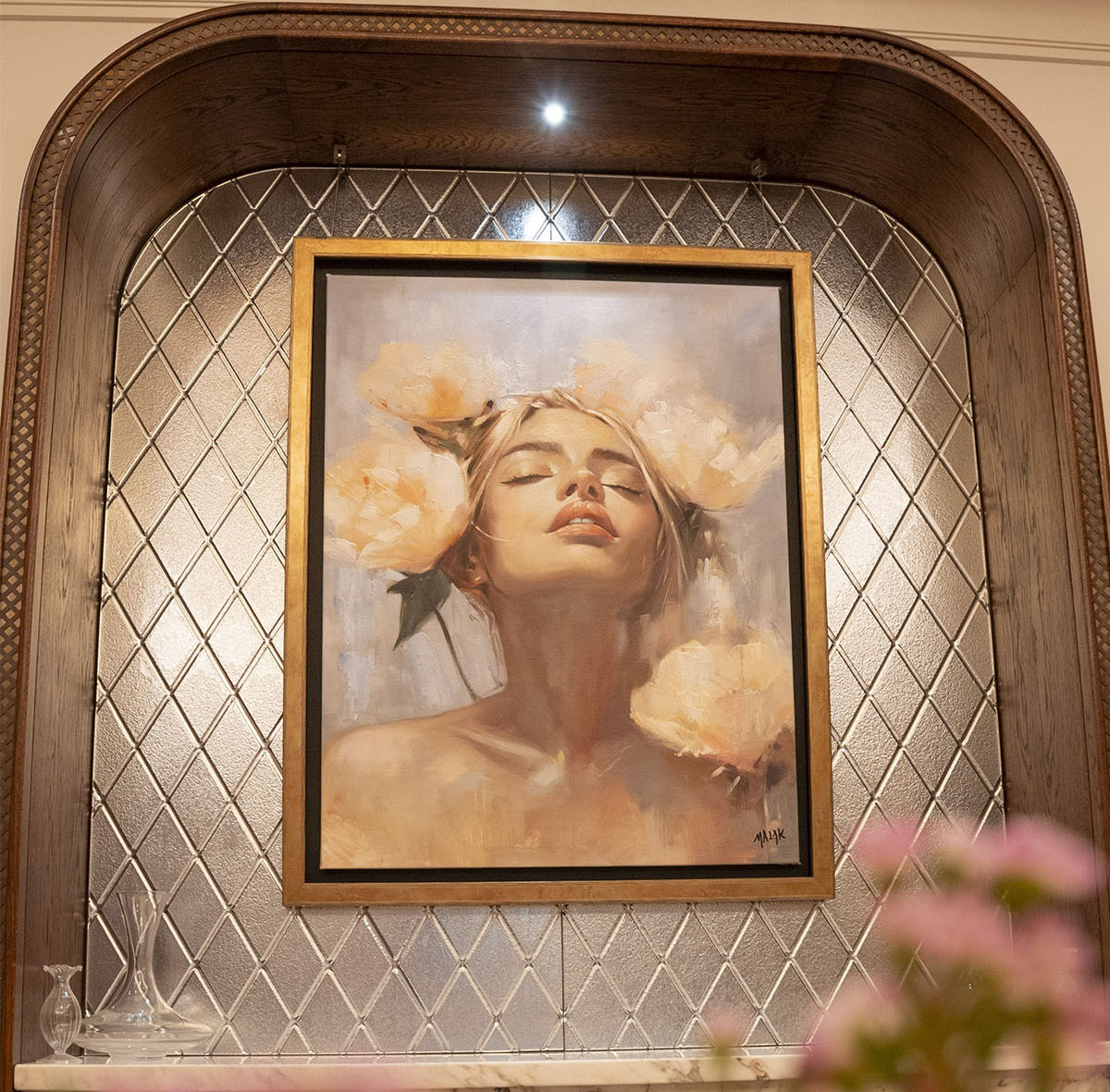 Gold-framed Gabrielle Malak portrait set into a mirrored alcove at La Maison Ani, London