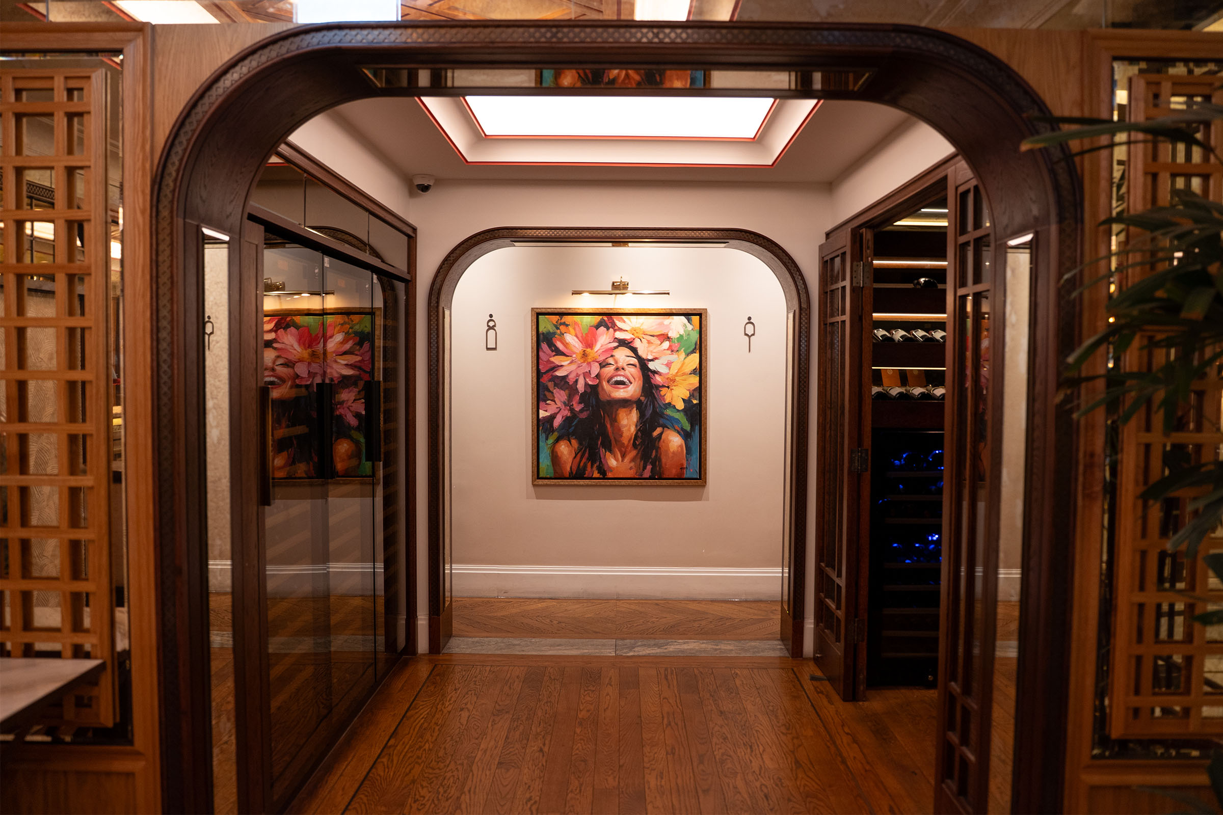 La Maison Ani wine room corridor with commissioned artwork