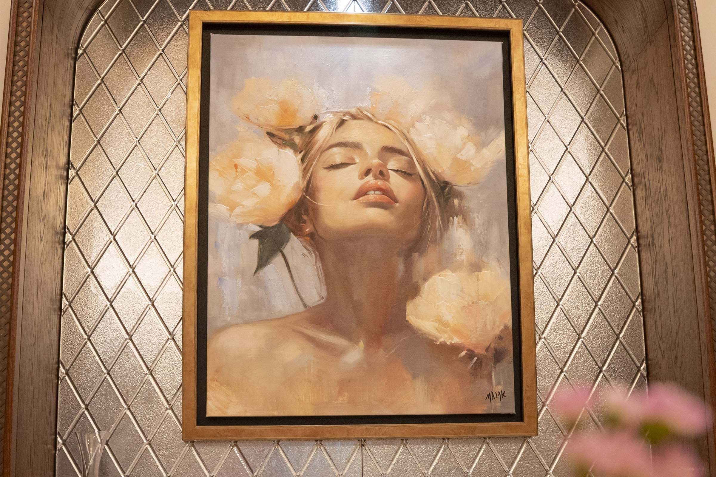 Floral installation framing artwork at La Maison Ani